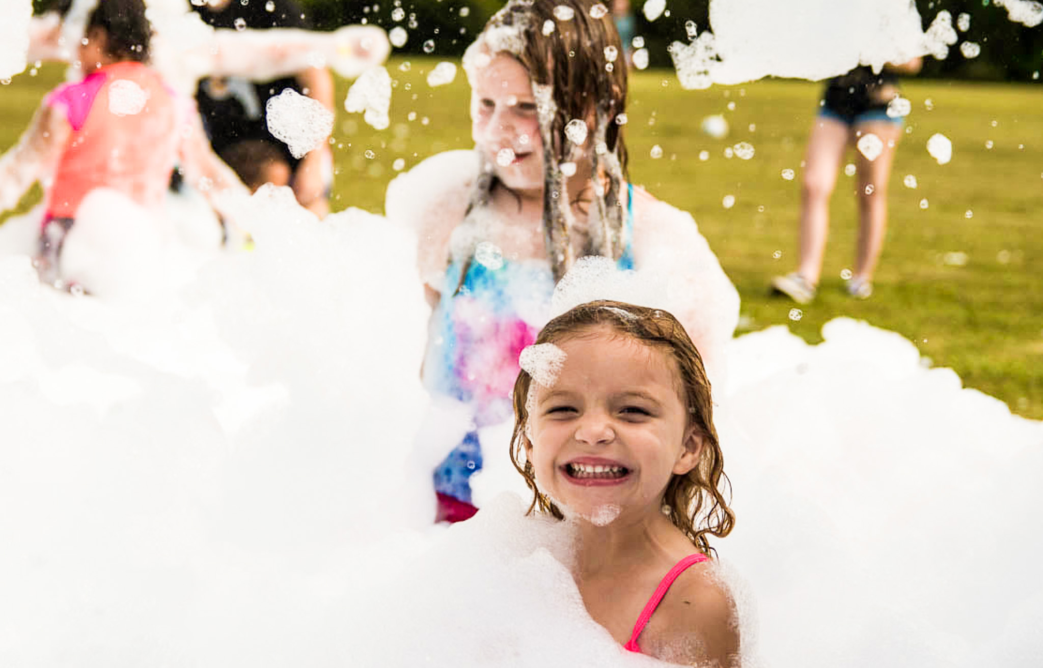 Teens celebrating at a foam party